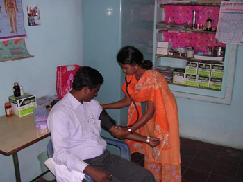 TBA taking Blood Pressure of a patient in Shedeshwar Sub Centre